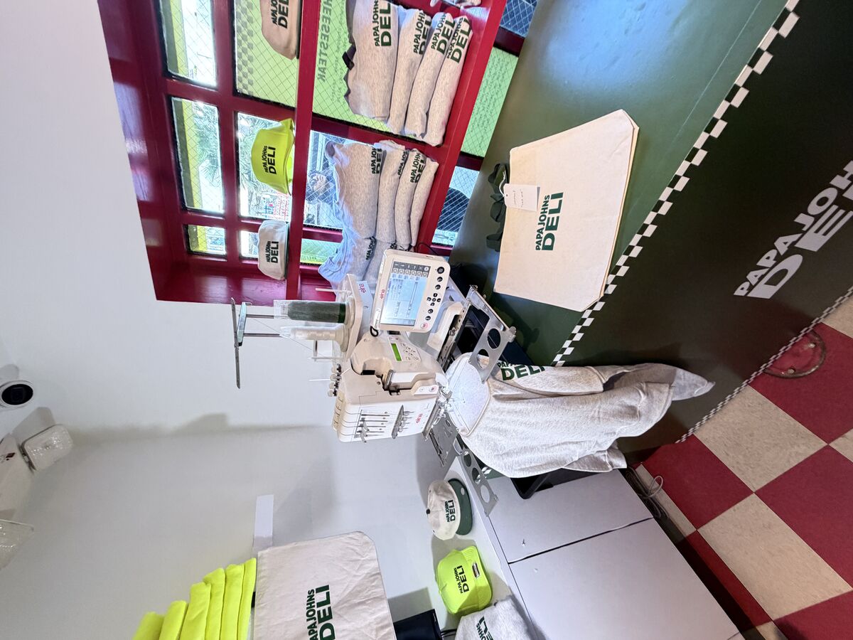 Embroidery and patch station running live at a corporate event