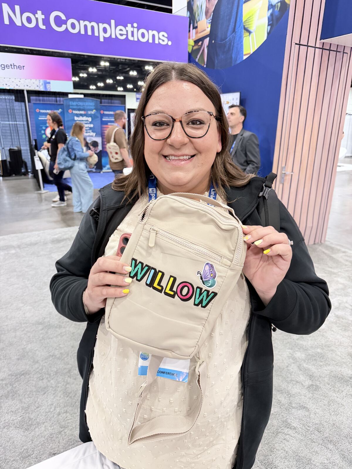 Guest holding a branded tote bag customized at a corporate event